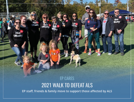 Group of people stand together on a sunny day. Text reads: 2021 Walk to Defeat ALS